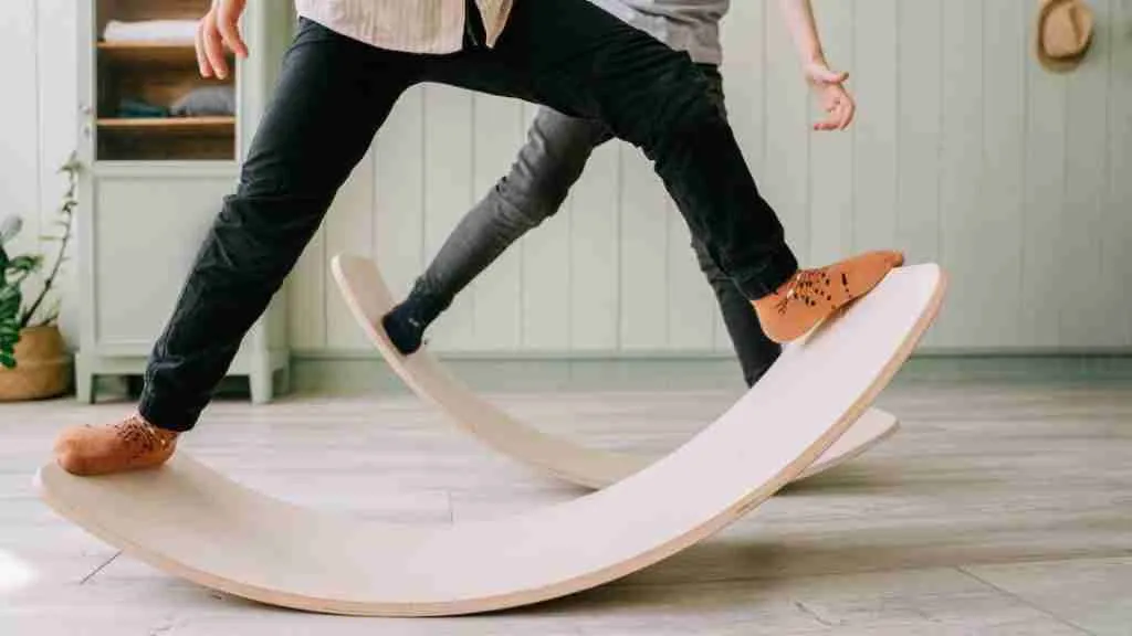 Children balancing on balance board