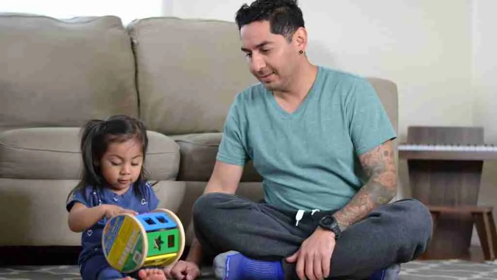 navigate toddler tantrums - dad playing with daughter