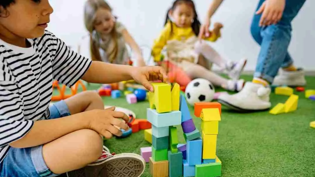 what is montessori play - kid building with blocks